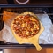 El tablero de bambú del queso de la pizza de la tabla de cortar de la cocina casera para las frutas se apelmaza